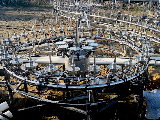 Large metal circular structure with multiple arms in an outdoor setting &ndash; HuiQi Fountain